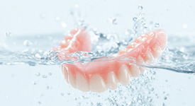 Always remove your dentures and rinse them well after eating