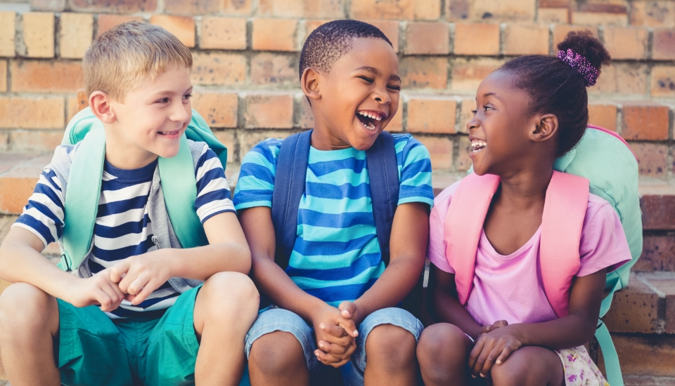 Three young people with healthy smiles after children's dentistry