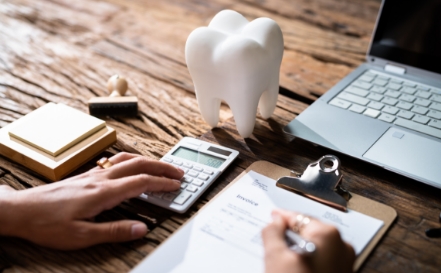 Dental patient completing dental insurance forms