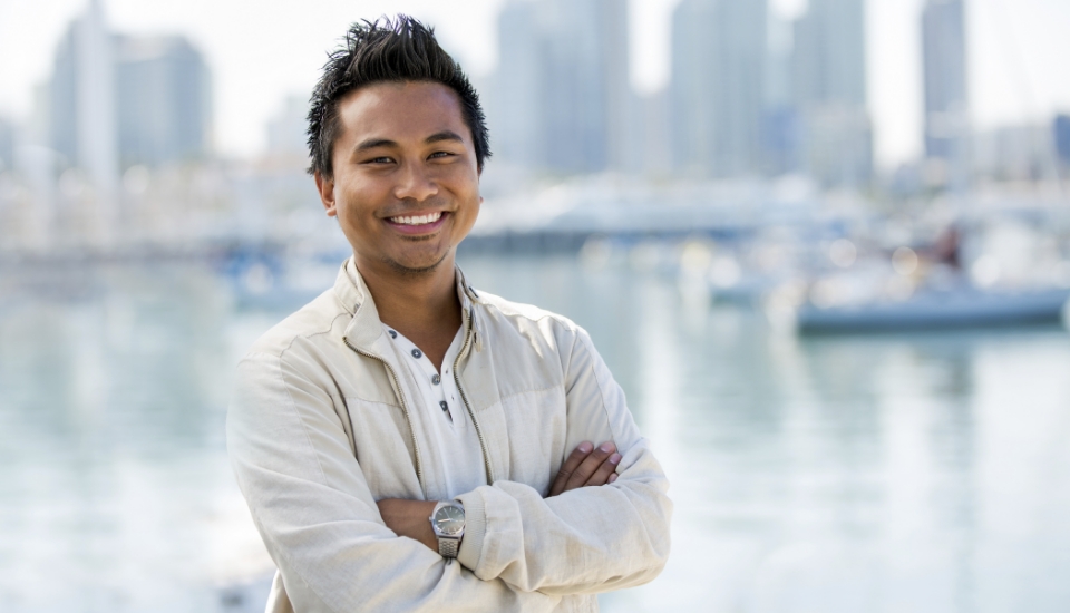 Man with flawless smile after replacing missing teeth