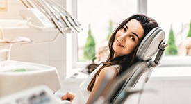 a dental patient smiling after undergoing treatment