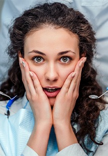 Woman afraid in the dental chair