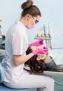 Woman getting a dental cleaning